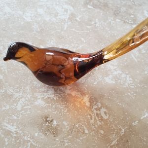 Small solid amber glass bird